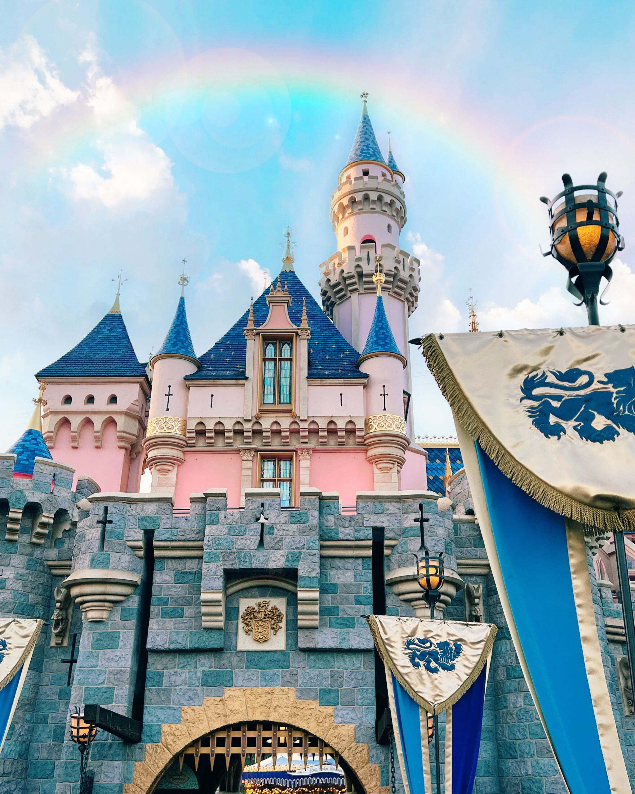 disneyland sleeping beauty castle with rainbow